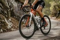 Cropped image of cyclist riding bike on country road Royalty Free Stock Photo