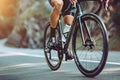 Cropped image of cyclist riding bike on country road Royalty Free Stock Photo