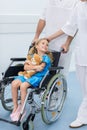cropped image of doctors moving smiling kid Royalty Free Stock Photo