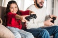 cropped image of father and daughter playing video game Royalty Free Stock Photo