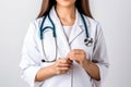 Cropped image of female doctor with stethoscope on white background