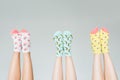 cropped image of female legs in different colorful socks