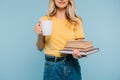 cropped image of girl holding books and cup of coffee Royalty Free Stock Photo