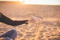 Cropped image of a girl shakes sand out of her shoe