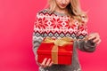 cropped image of girl in sweater opening present Royalty Free Stock Photo