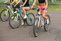 Cropped image of group of women sitting on bikes