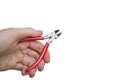 Cropped image of hand holding pliers over white background Royalty Free Stock Photo