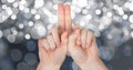 Cropped image of hands against glowing bokeh Royalty Free Stock Photo