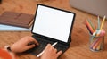 Cropped image hands are using a computer tablet. Royalty Free Stock Photo