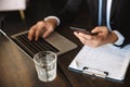 Cropped image of a handsome young businessman using phone Royalty Free Stock Photo