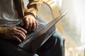 Cropped image of a hipster man typing on tablet keyboard at his house Royalty Free Stock Photo