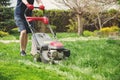 Lawn mower man working on the backyard. Royalty Free Stock Photo