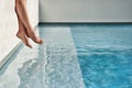 Cropped photo of Legs by Swimming Pool Royalty Free Stock Photo