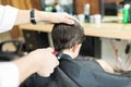 Barber Giving Haircut To Client Using Trimmer In Shop Royalty Free Stock Photo