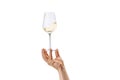 Cropped image of male hand holding glass with white wine isolated over white background Royalty Free Stock Photo