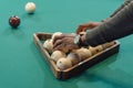 cropped image of male hands forming balls set by triangle on pool gambling Royalty Free Stock Photo
