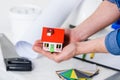 cropped image of man holding small house Royalty Free Stock Photo