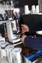 Cropped image of man preparing coffee at mobile coffee shop