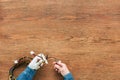 cropped image of man with prosthetic arm cutting wires by nippers