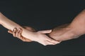 cropped image of multicultural couple holding hands Royalty Free Stock Photo