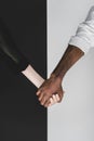 cropped image of multicultural couple holding hands, yin Royalty Free Stock Photo