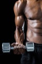 Cropped image of muscular man exercising with dumbbell Royalty Free Stock Photo