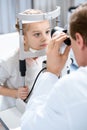 cropped image of ophthalmologist examining vision of child