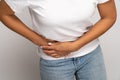 Sick woman touching right side suffer from acute abdominal pain in stomach, appendix or pancreatitis Royalty Free Stock Photo