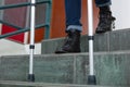cropped image person on crutches descending staircase Royalty Free Stock Photo