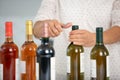 cropped image person opening bottles wine