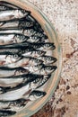 Cropped image of pile of fish on plate