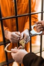 cropped image of prison warden wearing handcuffs