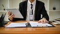Cropped image of a professional businessman or male banker is working on his task at his desk Royalty Free Stock Photo
