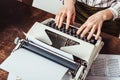 cropped image of retro styled african american writer typing Royalty Free Stock Photo