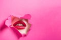 cropped image of seductive girl showing lips in hole Royalty Free Stock Photo