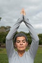 Cropped image of senior woman doing yoga in park Royalty Free Stock Photo