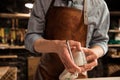 Cropped image of a shoemaker measuring a shoe