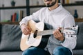 cropped image of smiling musician playing