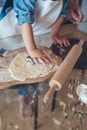cropped image of son making cookies Royalty Free Stock Photo