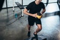 cropped image of sportsman training on step platform with medicine ball