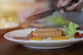 Cropped image of traditional English breakfast with fried eggs, sausages, beans, bacon and some vegetables on a plate Royalty Free Stock Photo