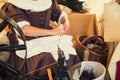 Cropped image of weaver in Middle Agesl clothes make yarn on spinning wheel. Medieval crafts, occupation. The concept of historica Royalty Free Stock Photo