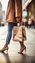 woman in beige coat holding shopping bags