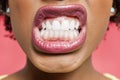 Cropped image of woman clenching teeth