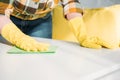 cropped image of woman dusting table