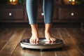 Cropped image of woman feet standing on weigh scales