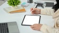 Cropped image of woman hand using stylus pen writing on blank empty screen digital tablet at office desk Royalty Free Stock Photo