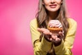 cropped image of woman holding cupcake
