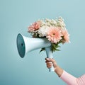 image of woman holding megaphone with flowers on blue background