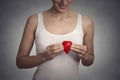 Cropped image woman holding red drop of blood